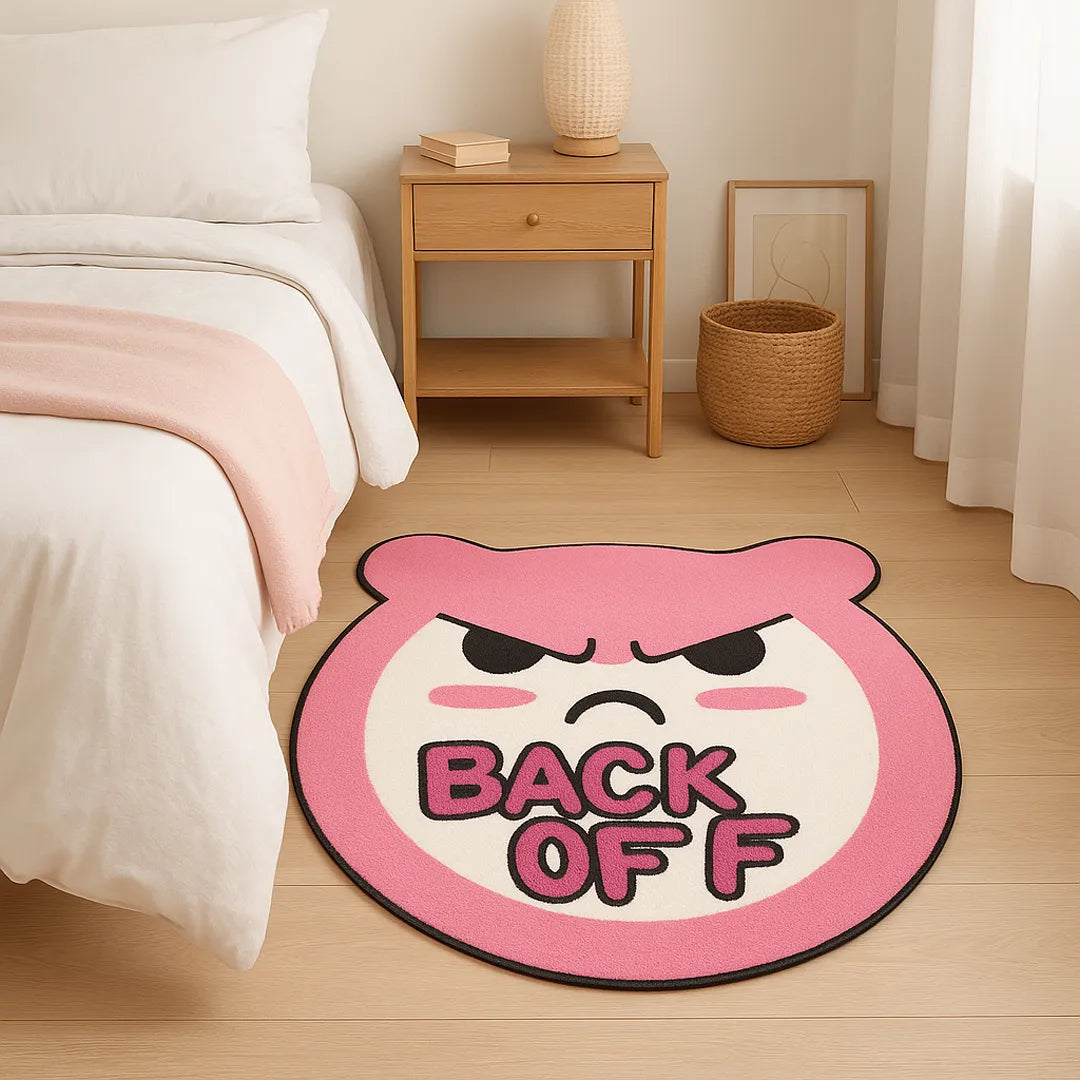 Irregular black βBACK OFFβ phrase rug styled beside a bed in a cozy neutral bedroom, showing the faux-cashmere texture and small accent rug size for teen girl room decor.