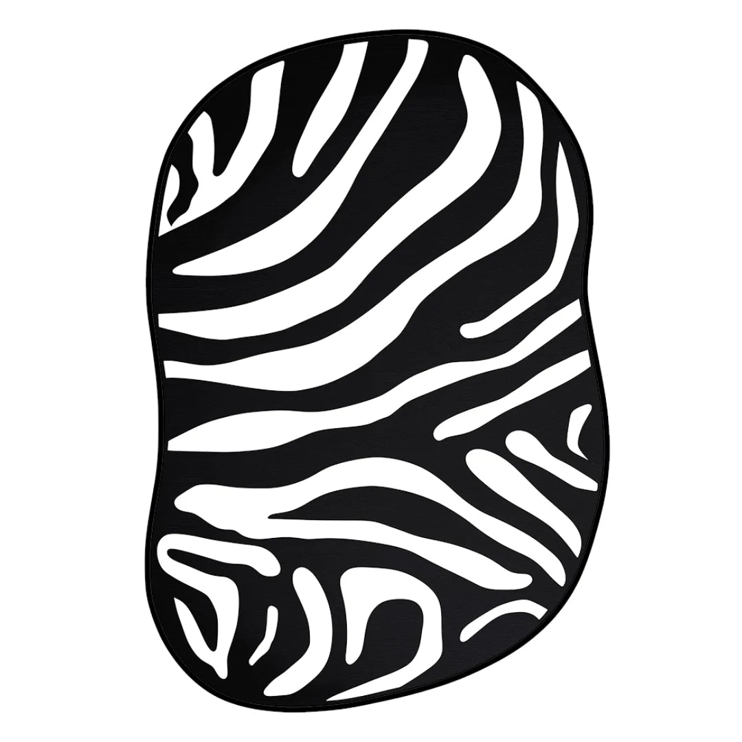 Irregular black and white zebra pattern rug with organic wavy stripe design