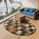 Irregular earthy green and beige rug balcony nook