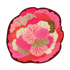 Irregular pink floral rug featuring layered rose-pink petals in blush, coral, and cream tones