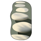 Irregular neutral stone pattern rug featuring layered oval shapes in soft cream and sage tones for hallway entryway