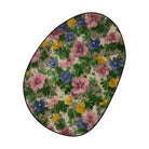 Floral wildflowers rug featuring pink, blue, and yellow flowers with green leaves on a soft beige background