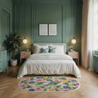 Floral wildflowers rug placed in a calm bedroom with green walls, soft bedding, and natural light