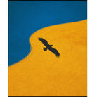 Black silhouette of a bird flying over a yellow landscape with a blue sky.