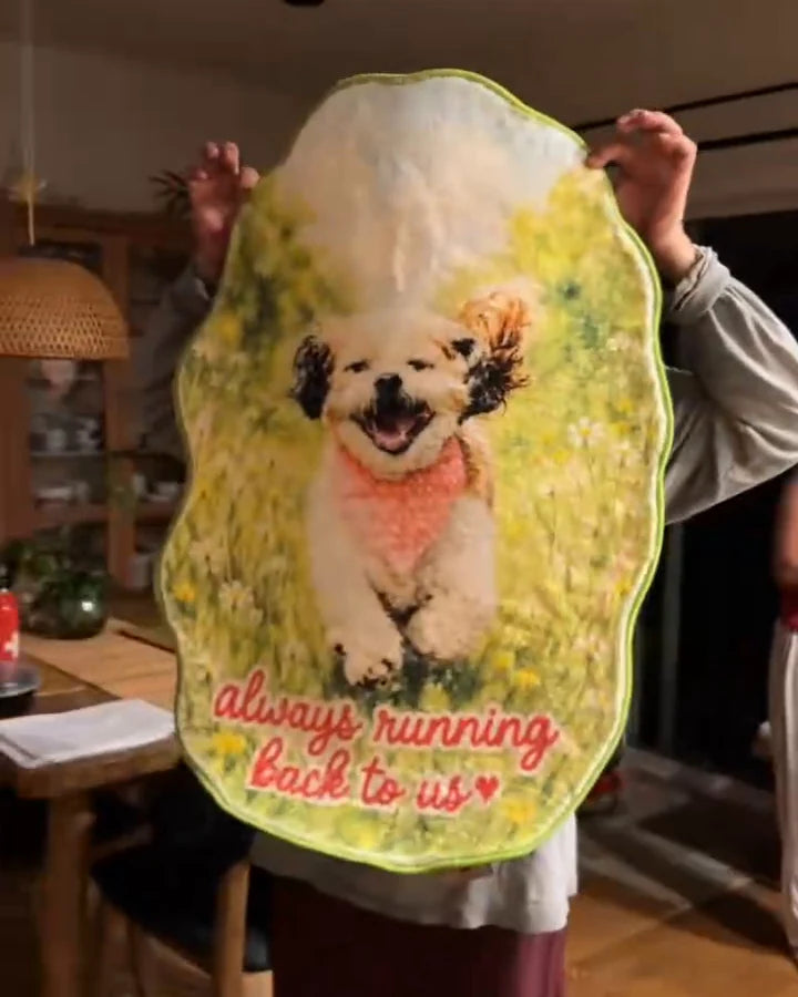 A family member holds Chaktah’s finished custom-shaped memorial rug at home.

