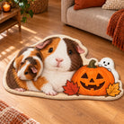 Custom Halloween guinea pig shaped faux cashmere rug with almond edging and a real guinea pig resting on it